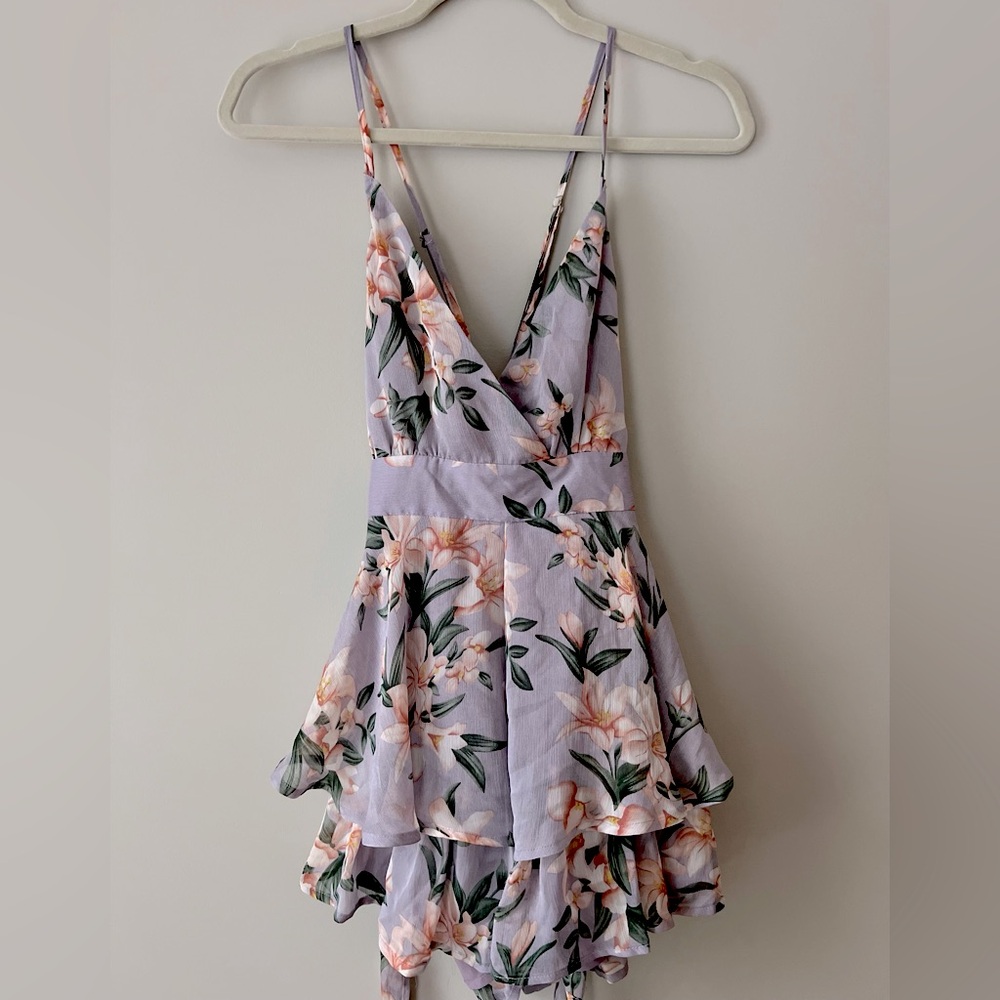 Floral, ruffle romper with tie back waist.
